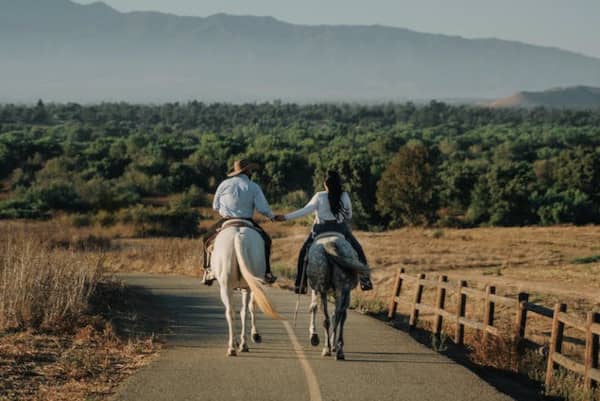 couple riding a horse together 600 400