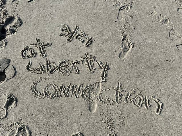 writing in the sand at the beach