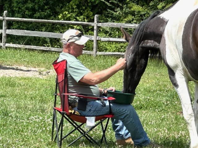 veteran sitting with horse (Small)