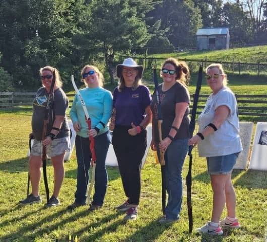 Group of participants standing near fence